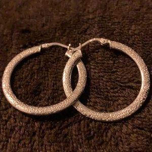Silver loops earrings all most size of quarter